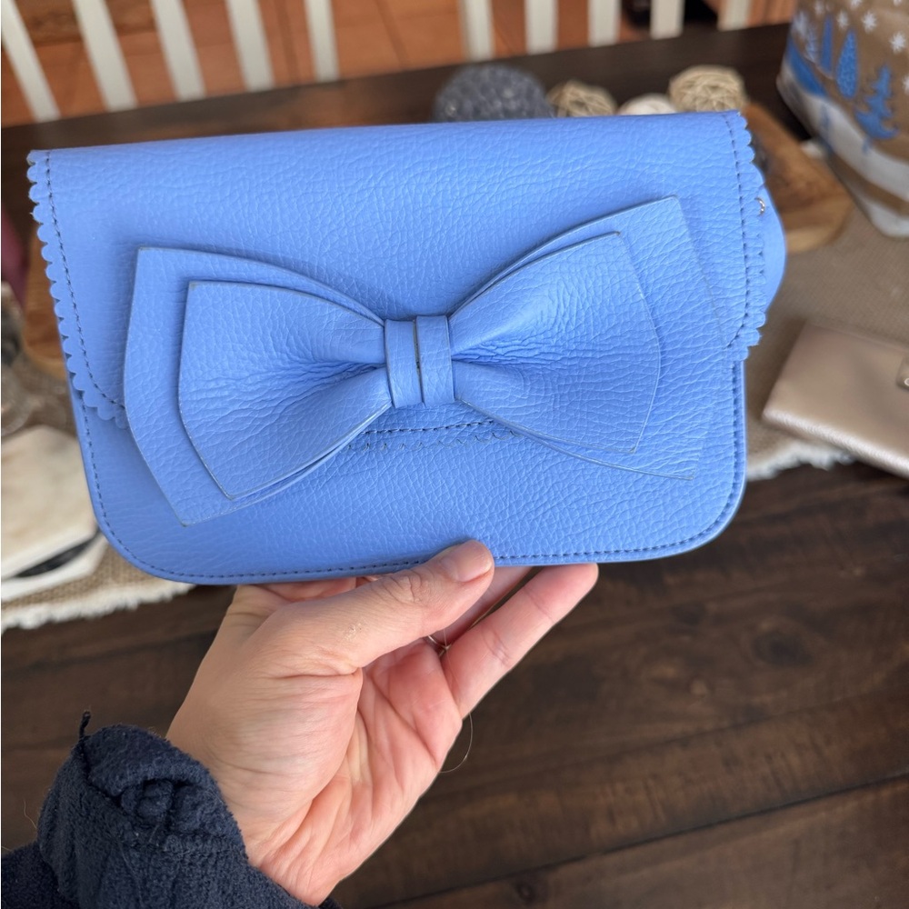Blue Kate Spade New York leather wallet with bow detail #KateSpade